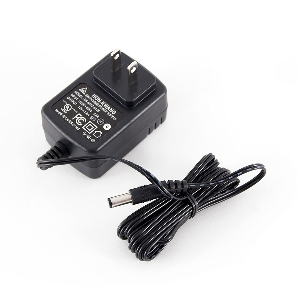 Battery charger outlet for lawn mower