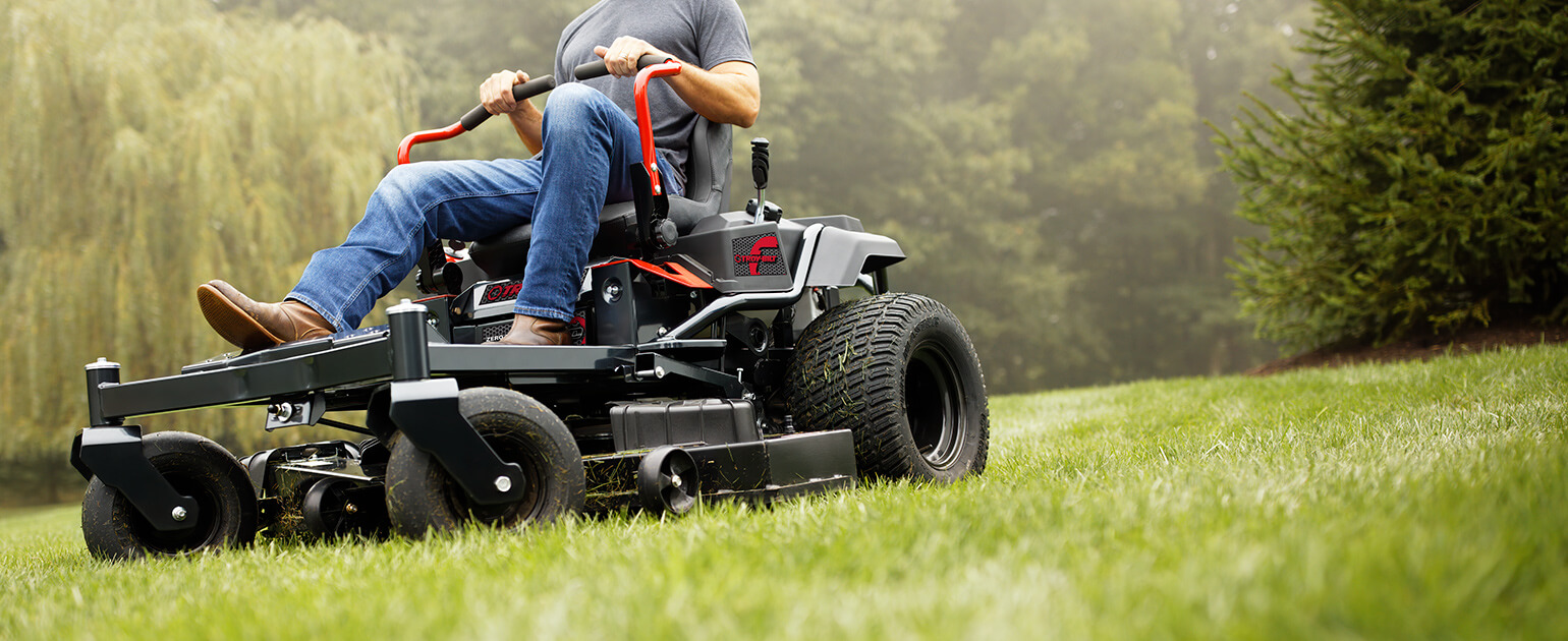 Man cutting yard with Troy-Bilt Zero-Turn Mower