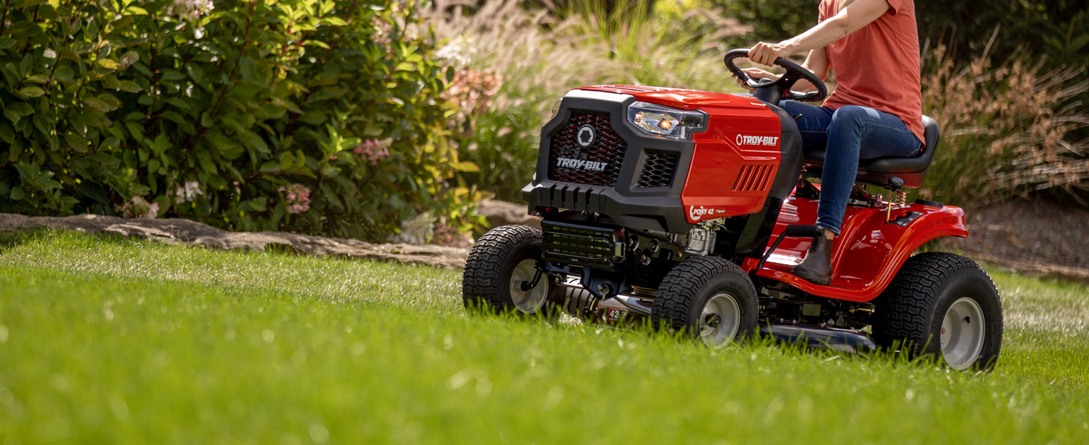riding mower cutting grass