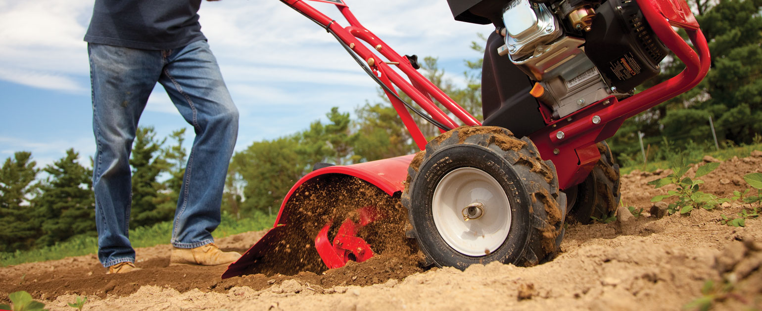 man tilling the ground