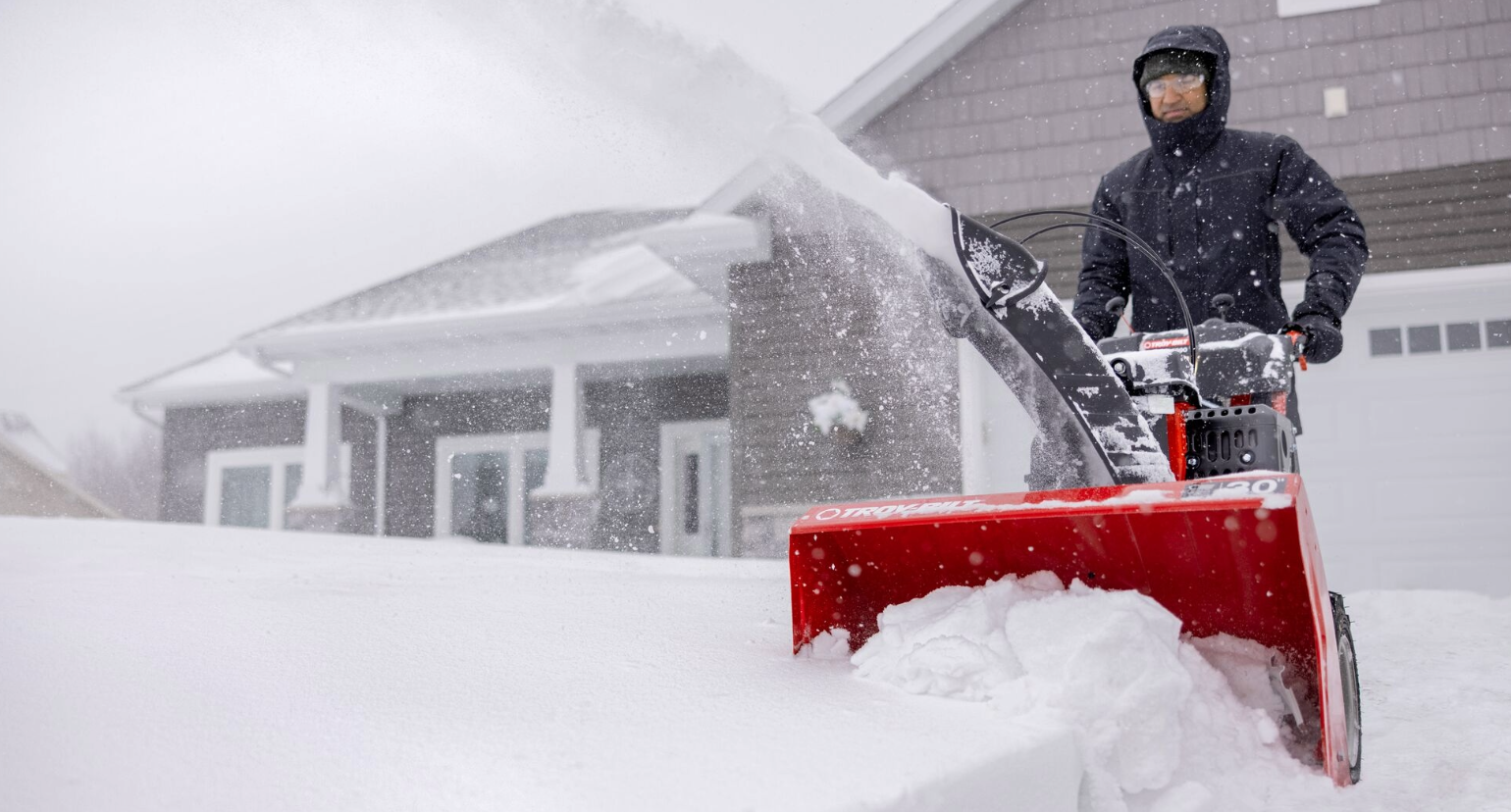 man on pier and riding lawn mower